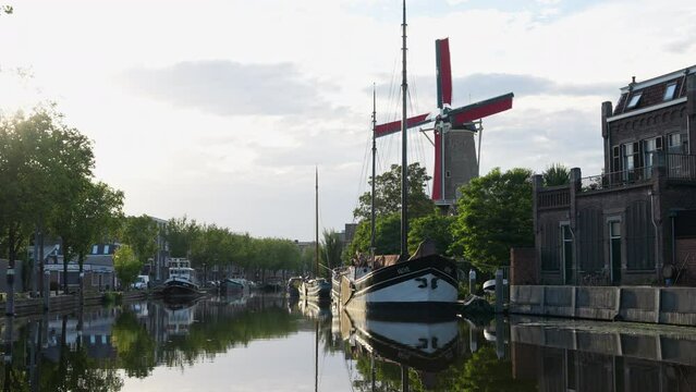 Old Boats Moored In The Marina Near The Molen de Roode Leeuw, Turfsingel, Gouda, Netherlands. - wide