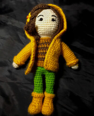 Amigurumi with yellow rain cover