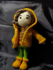 Amigurumi with yellow rain cover