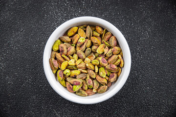 pistachios peeled without shell delicious nut eating cooking appetizer meal food snack on the table...