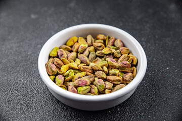 pistachios peeled without shell delicious nut eating cooking appetizer meal food snack on the table copy space food background rustic top view keto or paleo diet vegetarian vegan food