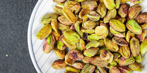 pistachios peeled without shell delicious nut eating cooking appetizer meal food snack on the table copy space food background rustic top view keto or paleo diet vegetarian vegan food