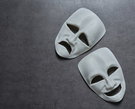 theatre theater theatrical tragedy drama comedy mask on grey background. theatre theater theatrical tragedy drama comedy mask. white happy and sad theatre theater theatrical tragedy drama comedy mask