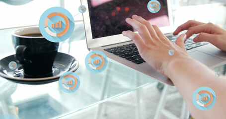 Image of multiple graph icon in circles over coffee cup and caucasian woman working on laptop