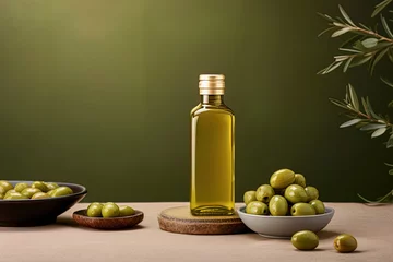 Fototapeten Mock up with plump green olives and bottle of premium olive oil © IonelV