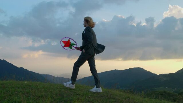 Slow motion shot of a woman holding a star lantern celebrating the mid-autumn festival
