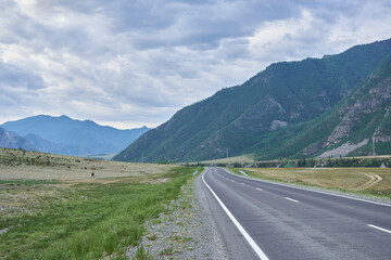 Road in the Altai mountains, Siberia, Russia. Summer landscape.