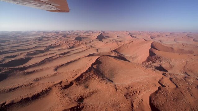 Aerial view of the Namib desert with fog at sunrise in Namibia, Africa.