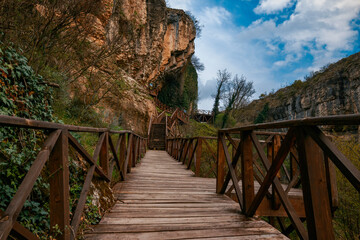 Tokatlı canyon with wooden path and stairs among greenery on a sunny day. Safranbolu, Karabuk, Türkiye