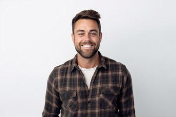 Portrait of happy young man in checkered shirt on white background