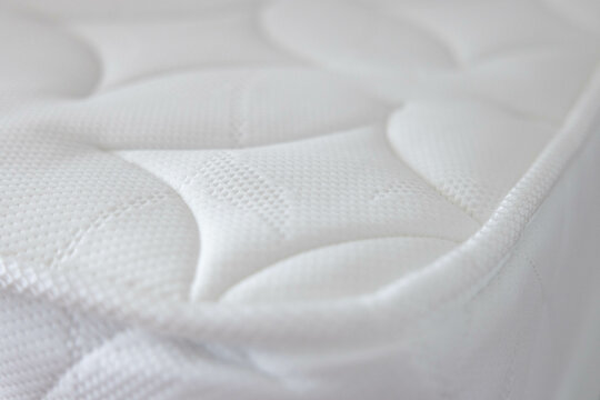 the white soft mattress background and texture. white new bed without dust mites. concept : allergy in bed room