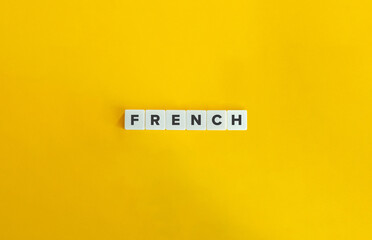 French. Letter Tiles on Yellow Background. Minimal Aesthetic.