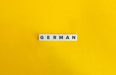 German. Letter Tiles on Yellow Background. Minimal Aesthetic.