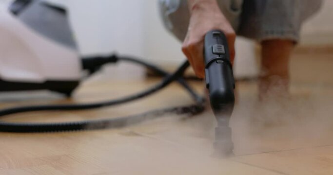 professional cleaning steam generator cleaning tiled floor in the kitchen