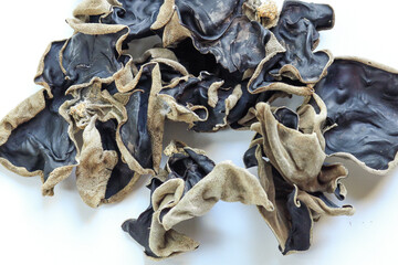 Dried black mushroom isolated on white background. Chinese black fungus or tree black muer fungus.