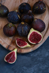 still life figs on a wooden plate