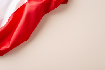 Top view image of a fluttering Poland flag against a plain white background, with an open area for text or advertising placement