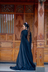Obraz premium Women's fashion model. Female makeup model. Asian woman. Indonesian women. wearing a black wedding dress. Black wedding dress.