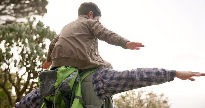Father, son and outdoor on shoulders for airplane games, hiking or bonding for love, care or sunshine. Man, boy child and plane for freedom, balance or piggy back in park, forest or woods in summer