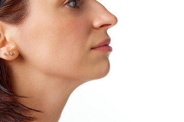 Close-up cropped photo of brunette good-looking woman face, eyes, nose, neck, chin. Beauty anti...