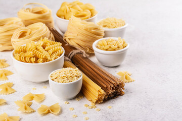 Pasta month. Assortment of uncooked pasta and noodles. Italian food culinary concept. Collection of...