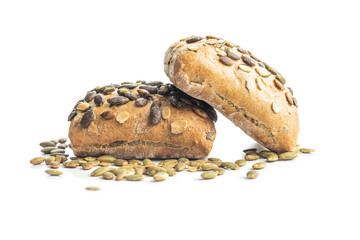 Whole grain bun with pumpkin seeds isolated on white background.