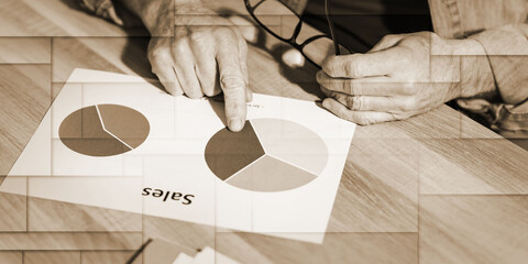 Businessman analyzing sales results, geometric pattern