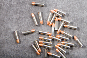 bullets on a gray background, top view, close-up
