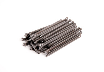 Pile Of Silver Shiny Sharp Metal Nails Isolated On White Background Closeup Photo