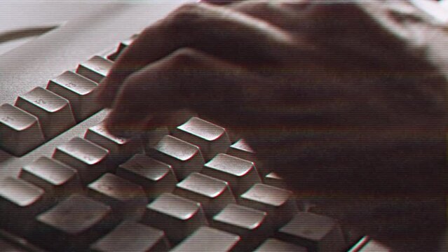 Computer engineer developer is working on old vintage computer 1990s. Antique classic pc keyboard and programmer typing hands. Internet web digital startup history. Outdated retro technology concept