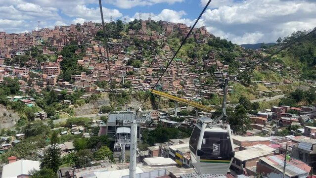 Views of Medellin city from cable car cabin in movement. Vacation in Colombia