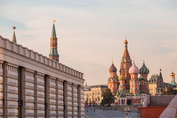 Fototapeta na wymiar MOSCOW, RUSSIA - SEPTEMBER 26, 2023: St. Basil's Cathedral on Vasilievsky Descent on Red Square on a sunny autumn evening against a bright blue sky. A popular tourist attraction in Moscow.