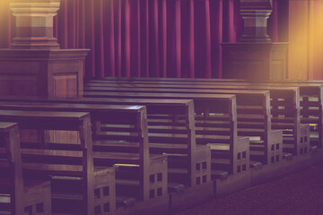 rows of empty old wooden pews in church, religious place background..