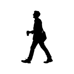 Silhouette of a male walking and carrying takeaway coffee cup.