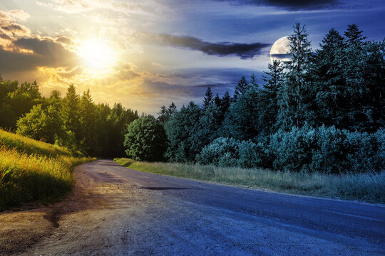 asphalt road with cracks turns right, passes through green shaded coniferous forest with sun and moon at twilight. day and night time change concept. mysterious countryside scenery in morning light