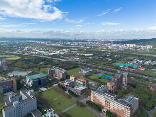 Fototapeta na wymiar National Taipei University Aerial View at Sanxia, New Taipei City, Taiwan. Beautiful campus with sunset and green grass.