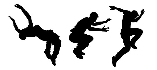 Silhouette of male parkour athlete in action. Silhouette of young man doing parkour jump. 