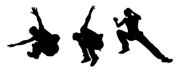 Silhouette of male parkour athlete in action. Silhouette of young man doing parkour jump. 