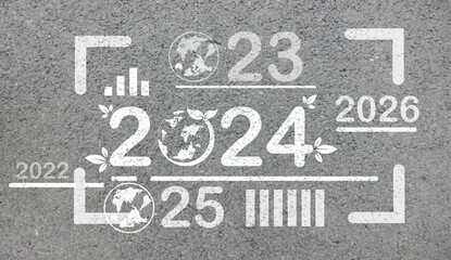 New Year 2024 or 2024, planning concept, start of success. Text 2024 written in the middle of a paved road. New Year's plans, goals and life are about to begin.