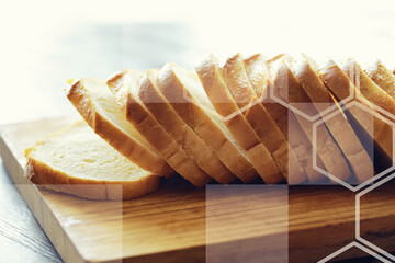 Slices white bread in plate on vintage wooden table with copy space