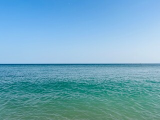 Fototapeta na wymiar Blue sea horizon, clear blue sky and seascape background