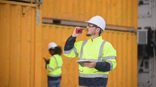 Engineers railway team wearing safety uniform under conversation document on hand inspection survey container boxes railway work station is industry transportation cargo import export concept.