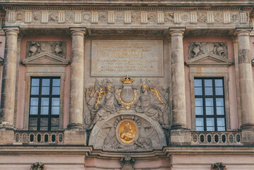 detail view of important building with gold elements decorated in german style and two simmetrical...