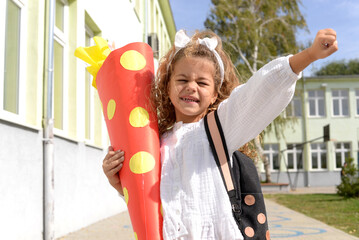 Girl's first day at school. Kids Go To School With Giant Cones. Celebrate school with a School Cone