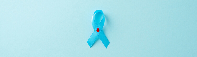 Stand together for Diabetes Awareness Month. Top-view photo of the diabetes emblem - blue ribbon...