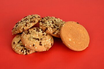 Cookies covered with sunflower seeds.