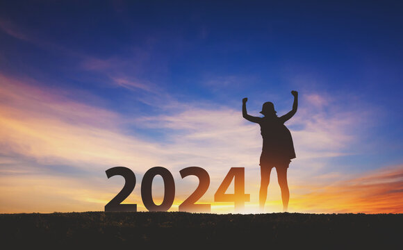 New year 2024 traveler woman with sunset sky background travel concept