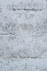 Gray stained concrete wall, dirty cracked cement surface close-up. Photography, abstraction.