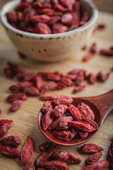 Goji berries on a wooden background