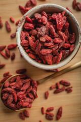 Goji berries on a wooden background